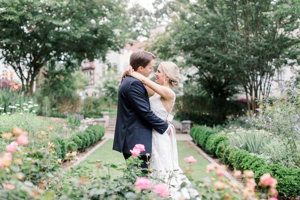 bride and groom smiling in gardens at Callanwolde Fine Arts Center in Atlanta