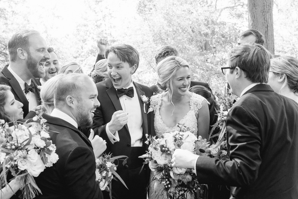 bridal party greeting couple on wedding day