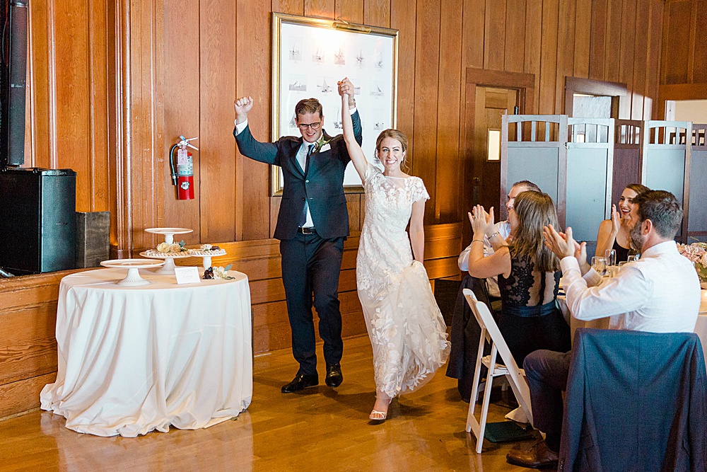 bride and groom entering their corinthian yacht club reception