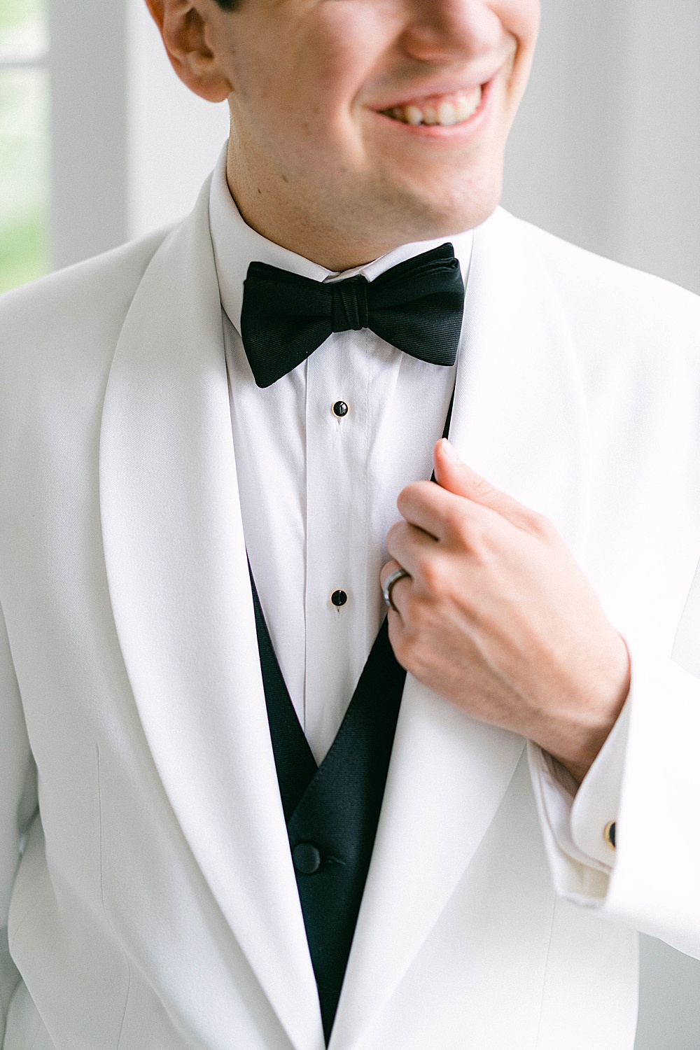 close up of a white coat for a wedding tux