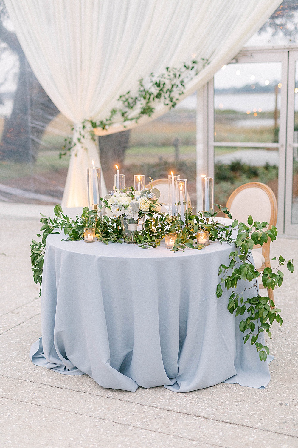 dusty blue sweetheart table with greenery