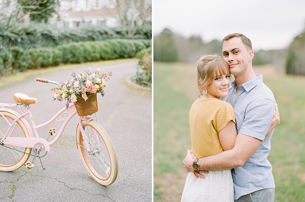 pink bike with wildflowers in the basket and a Engaged couple posing in a field at Meadowlark 1939 for their engagement pictures