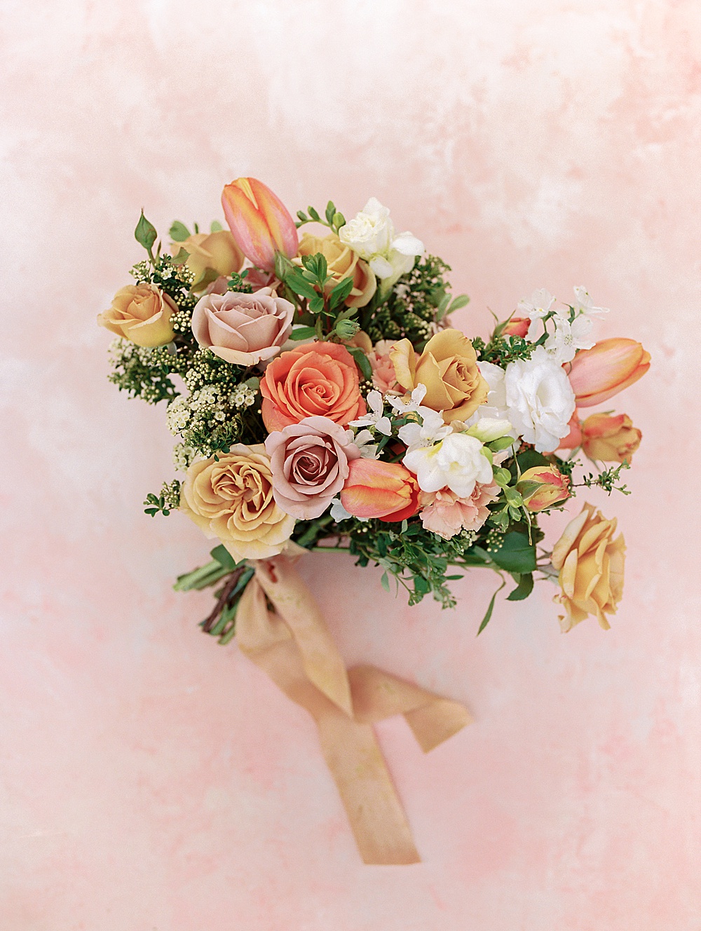 Wedding bouquet with pink, gold, white and orange