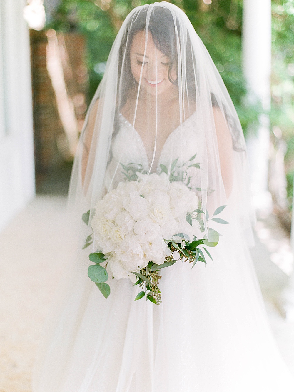 Bridal portrait with veil and all white bouquet