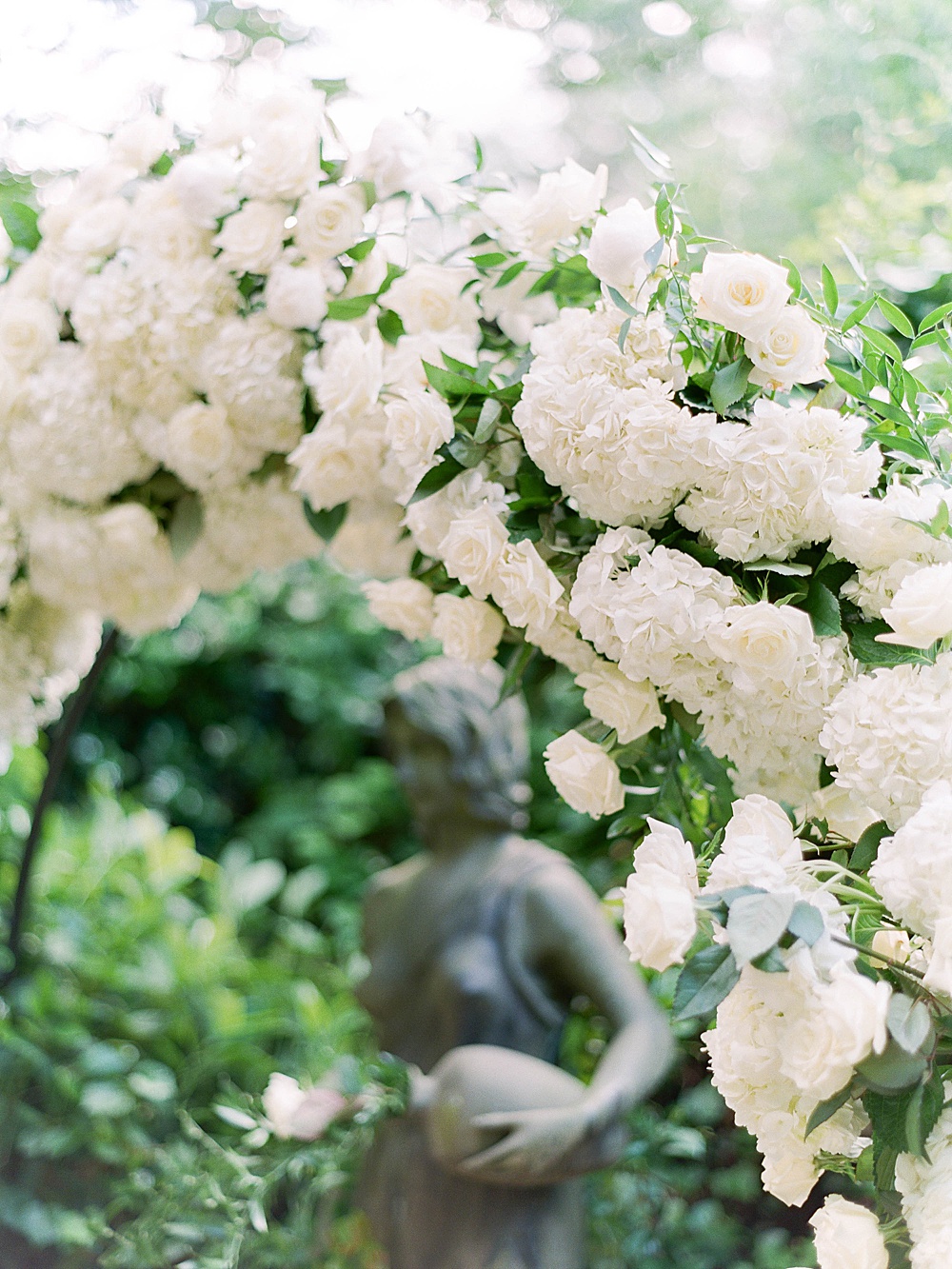 White floral arch with hydrangeas