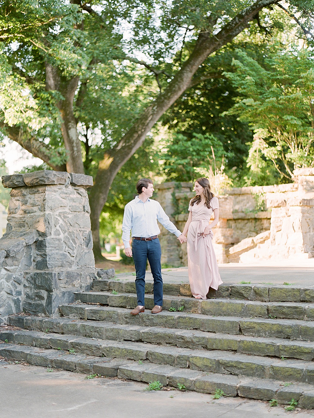 Engagement photos on the stone steps by Piedmont Park's athletic circle