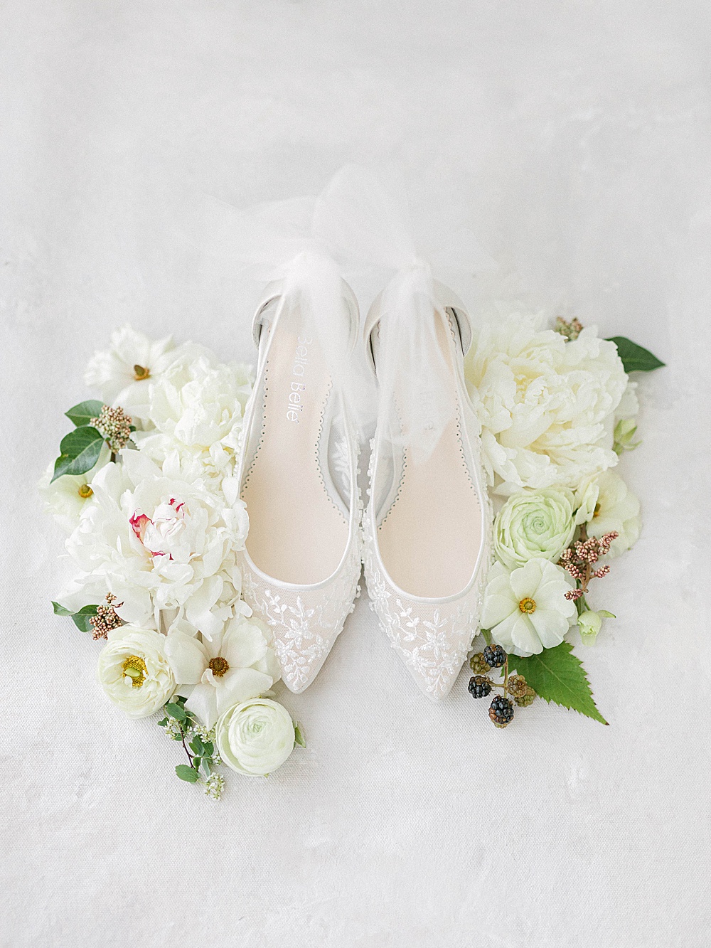 White Bella Belle wedding shoes with tulle bows for a Meadowlark 1939 elopement
