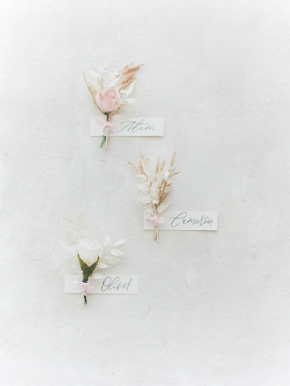 soft white and pink boutonnieres