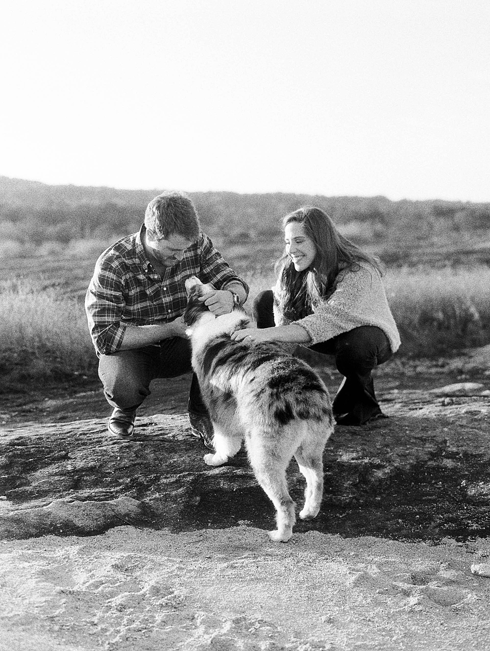 Black and white engagement photo on Arabia Mountain at sunset