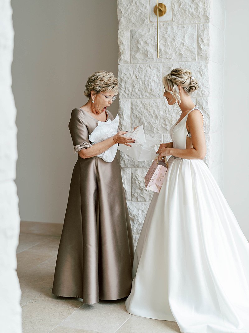 Mother and daughter giving gifts on their wedding day