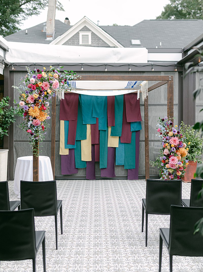 Jewel toned chuppah for a Jewish wedding at Sotto Sotto