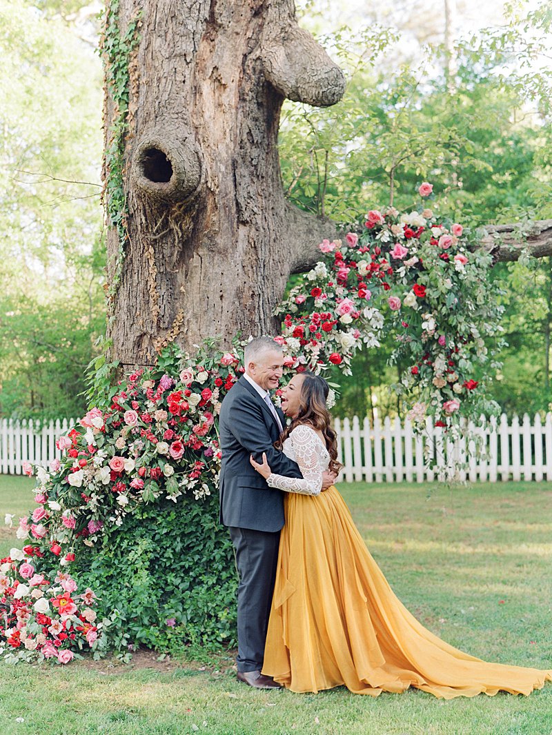 Garden wedding ceremony with a Bride wearing a yellow wedding skirt and lace top