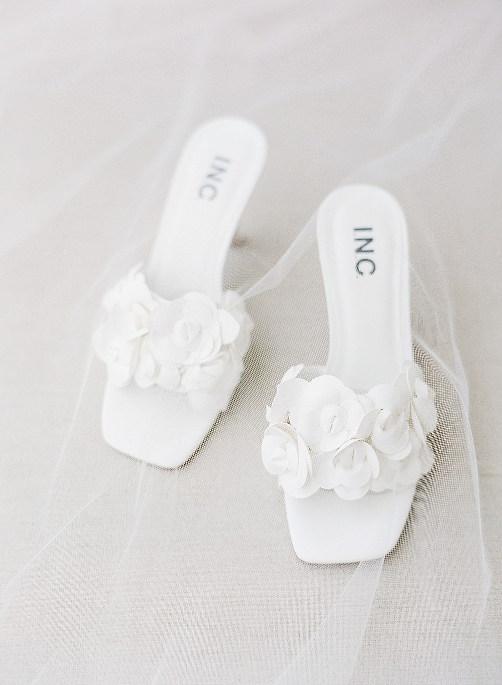 White wedding shoes with flowers