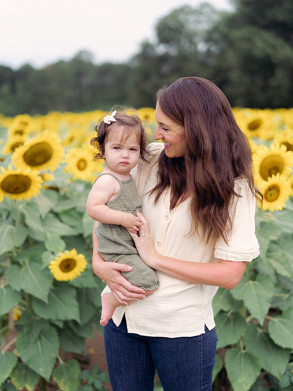 Mother and daughter in the sunflower fields at Gregg Farms