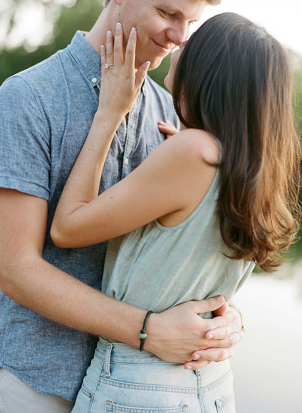 Couple hugging for their engagement portraits