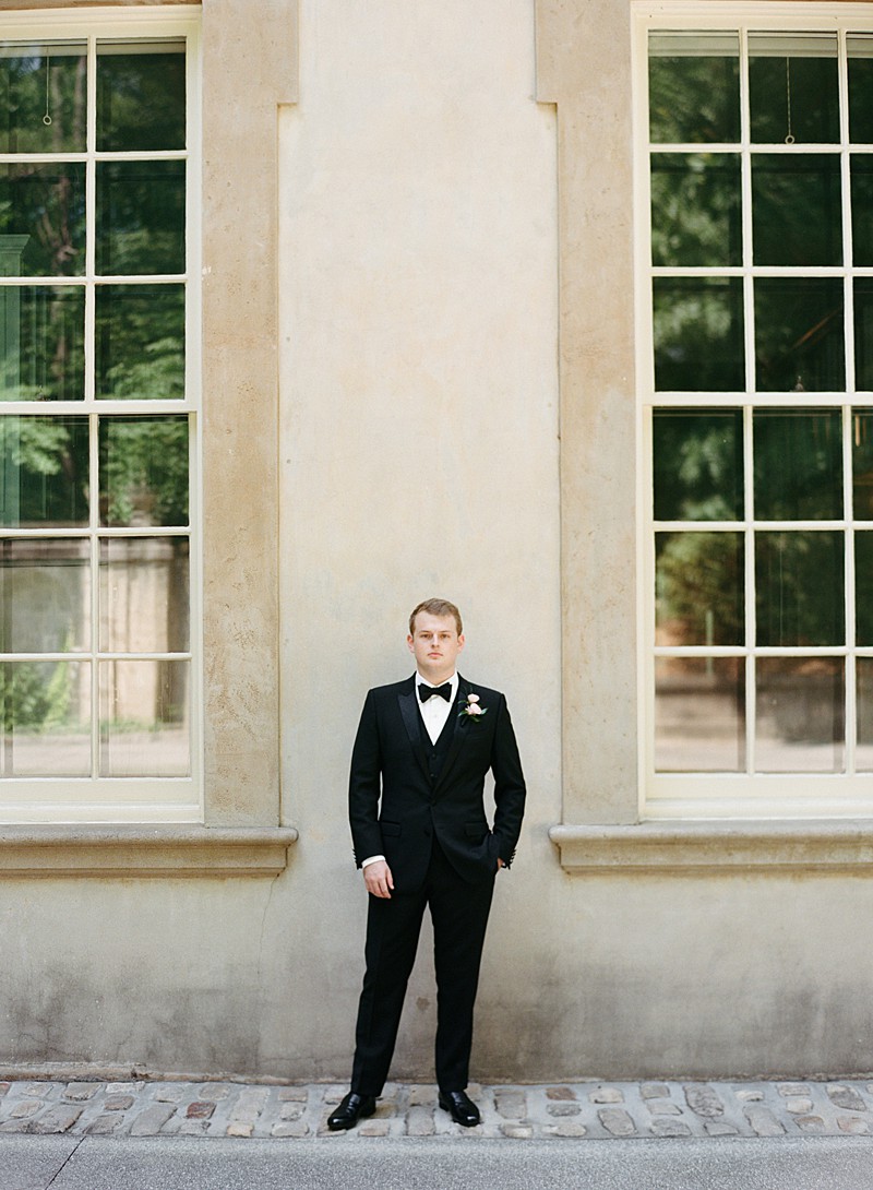 Portrait of a groom taken at the Swan House in Atlanta between two windows