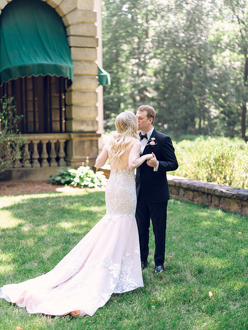 Bride and Groom share their first kiss at the Swan House in Atlanta