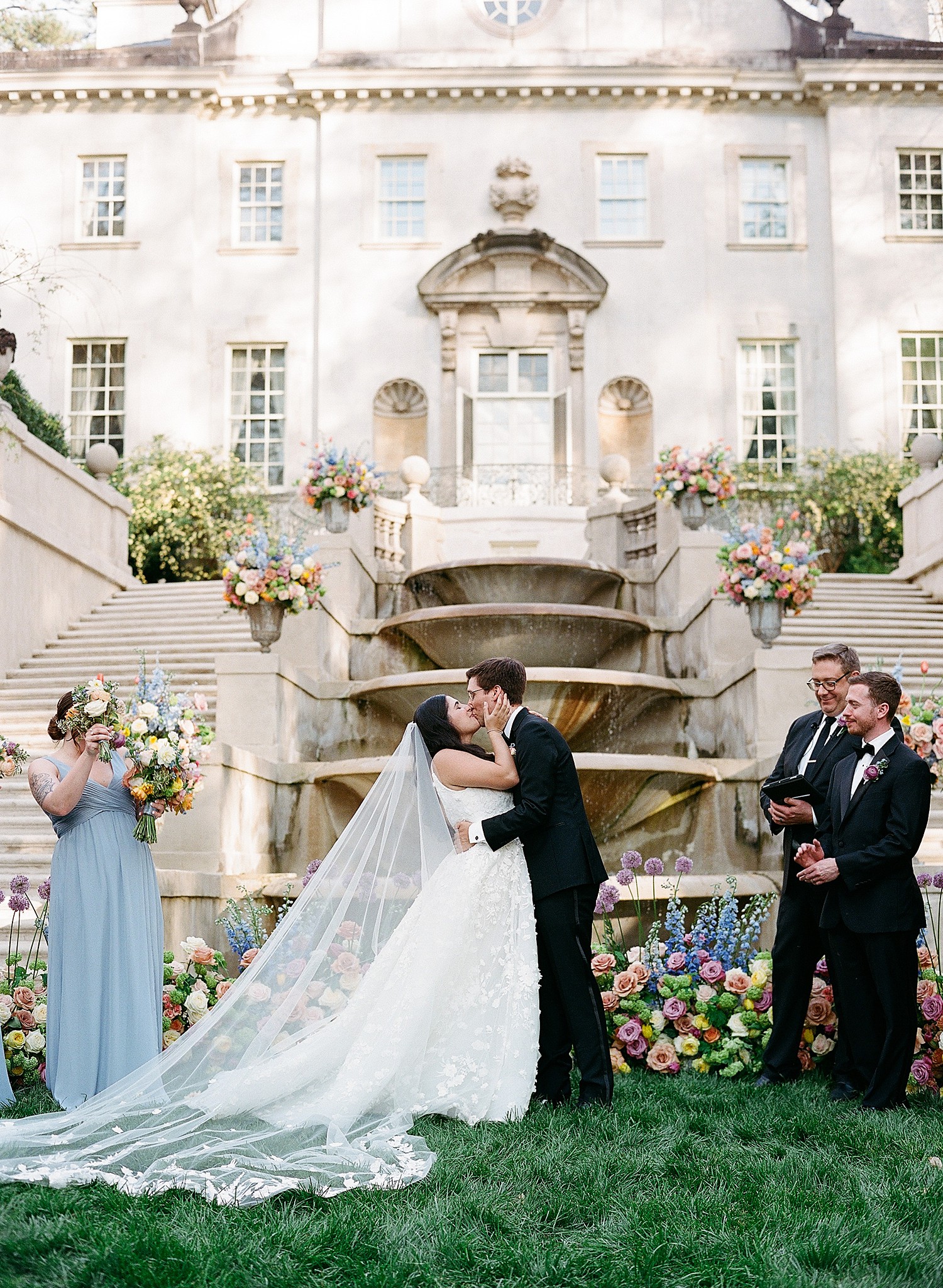 A congratulatory kiss after the ceremony of a bride and groom at the Swan House