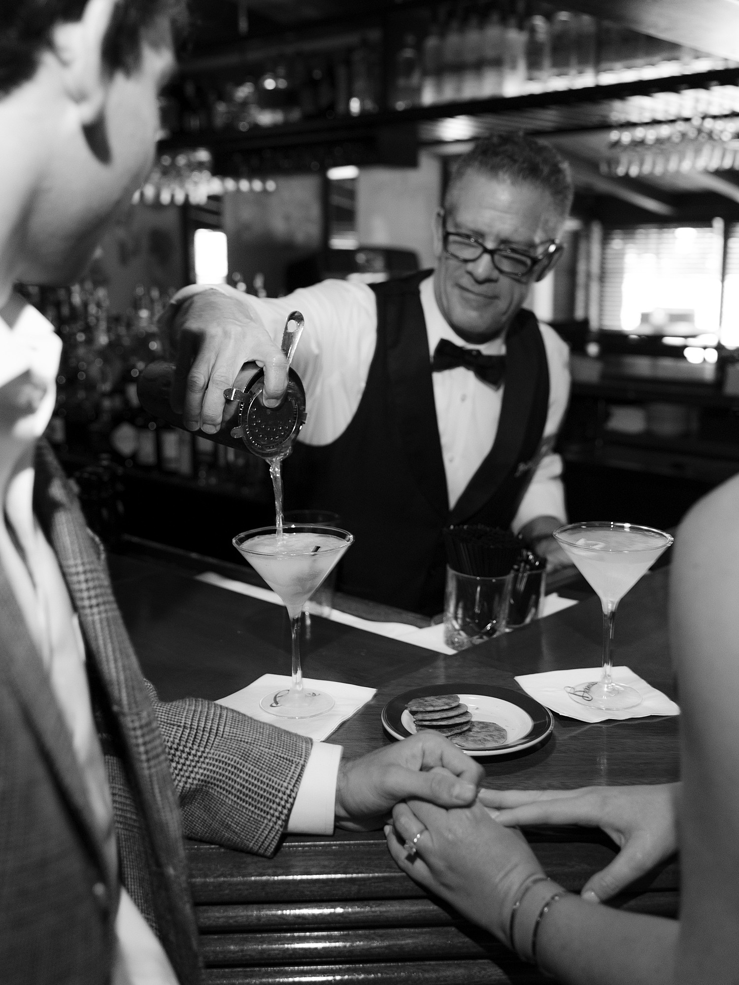 A bartender at Bones Restaurant in Atlanta pours a martini