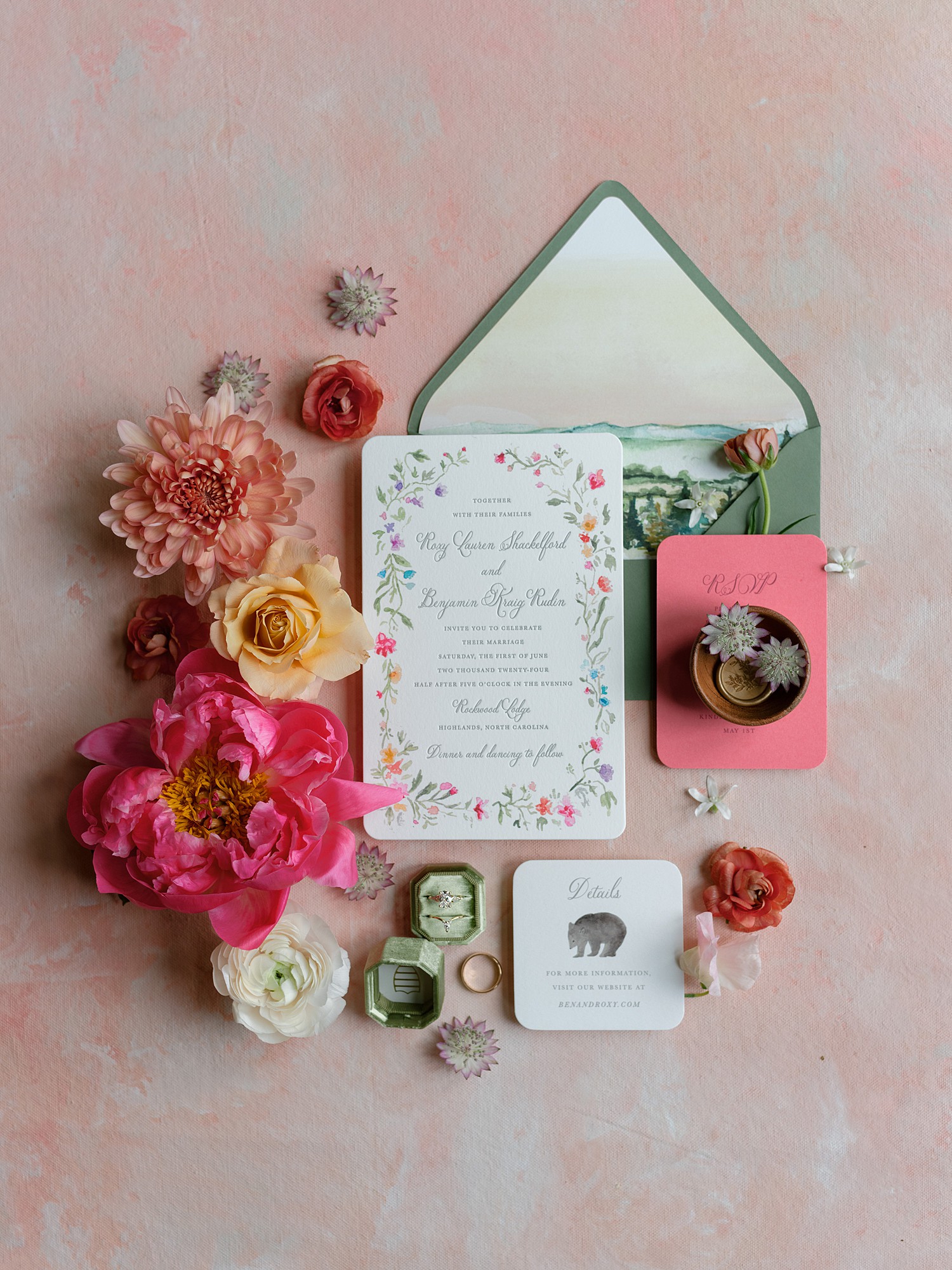 Wedding stationery by Paper Daisies featuring a green envelope and a smattering of florals on the left side