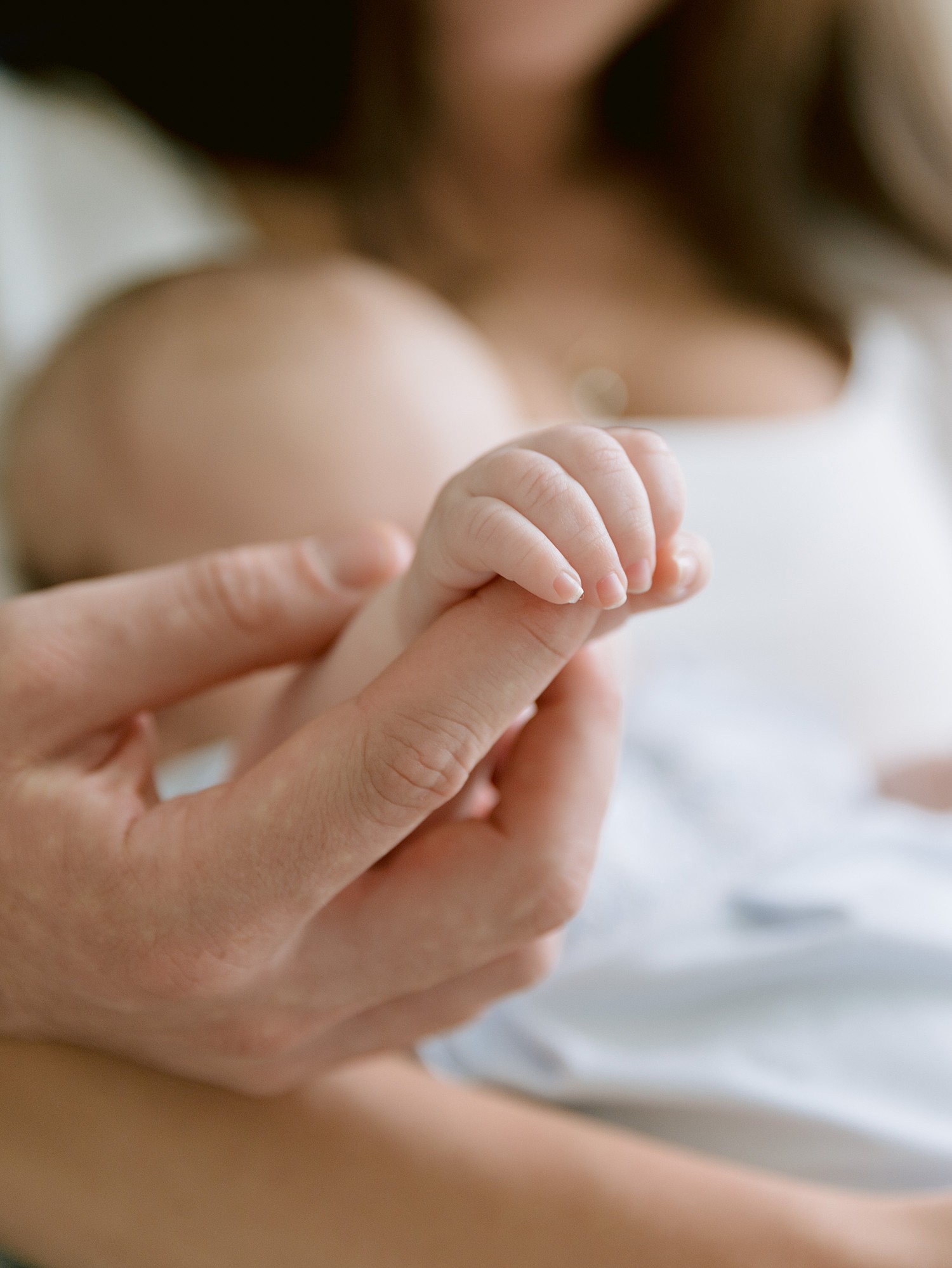 A close up of a little boy's tiny fingers