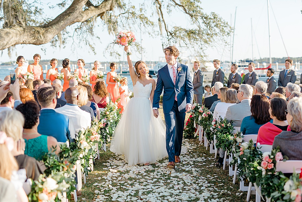 bride and groom celebrating after their ceremony at the savannah yacht club