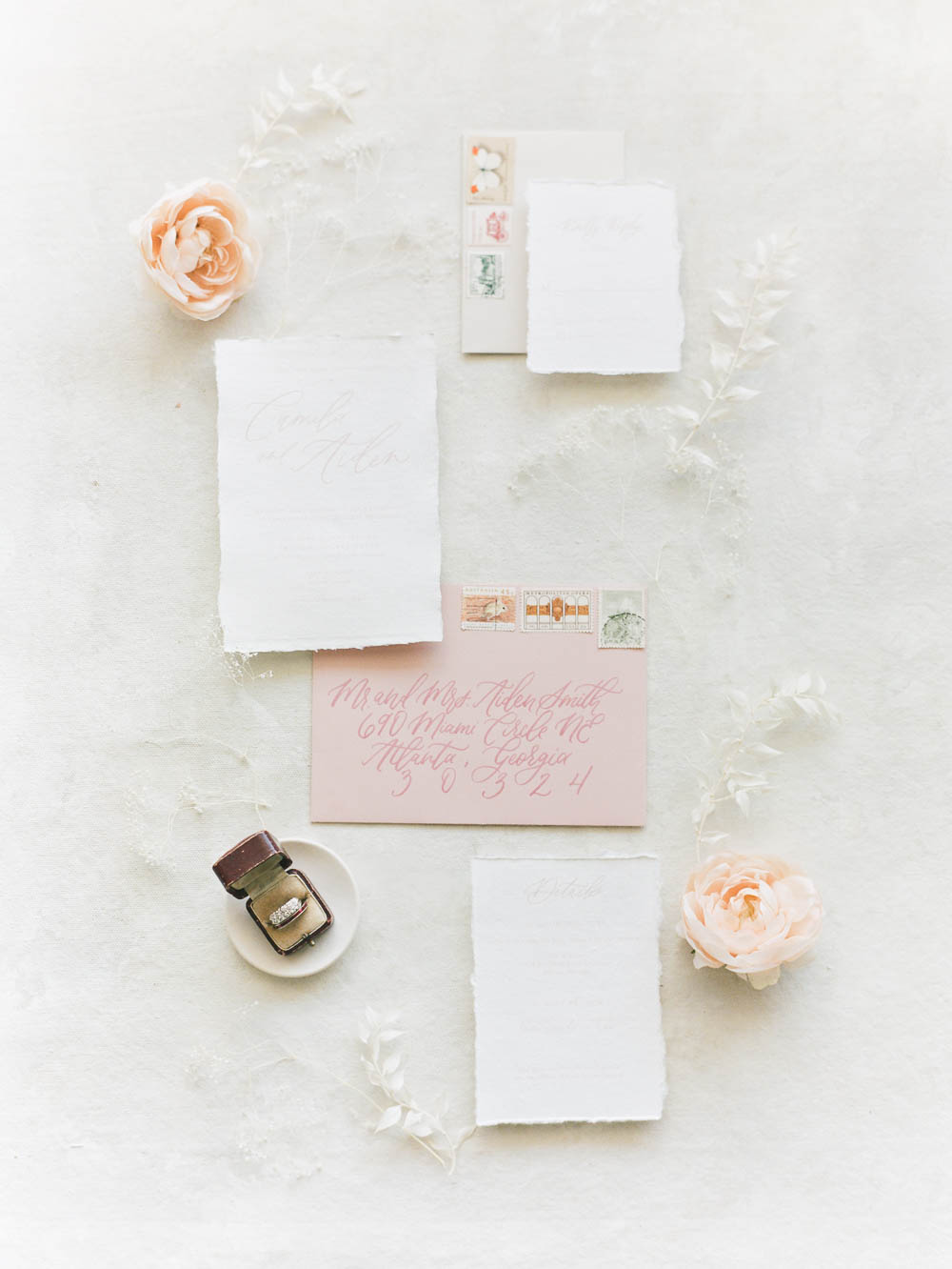 pink and cream invitation suite with torn edge paper styled by Taylor Dawn